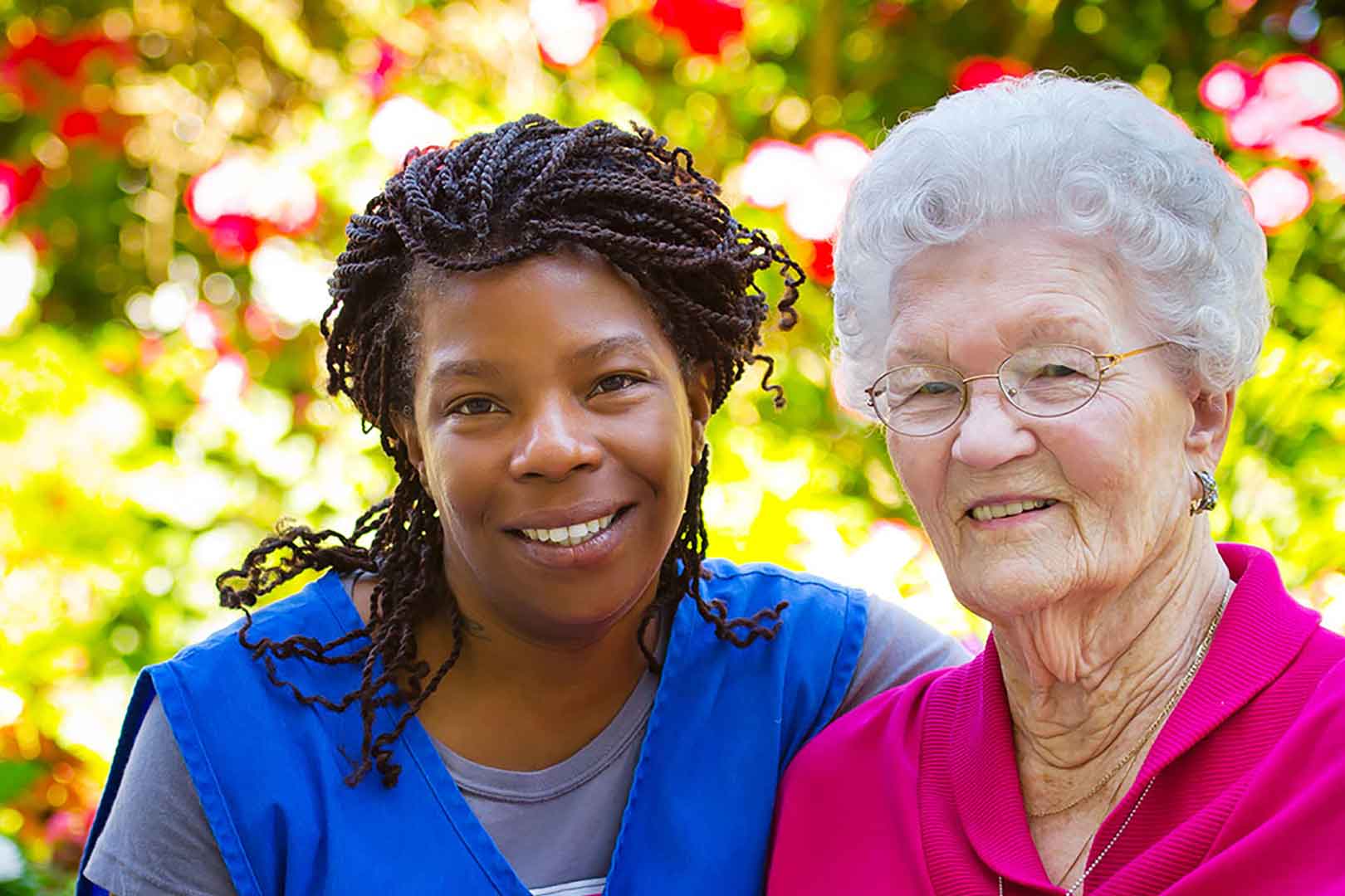 What is assisted living? Caregiver and Woman in Assisted Living, Outdoors, closeup