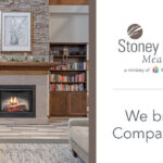 Cozy community fireplace lounge with seating, bookshelves, and a sign that reads “Stoney Point Meadows. We bring Compassion.”